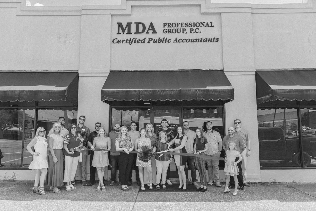 The MDA team cutting the ribbon at the Gadsden office